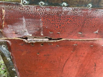 Wooden chest covered with studded burgundy...