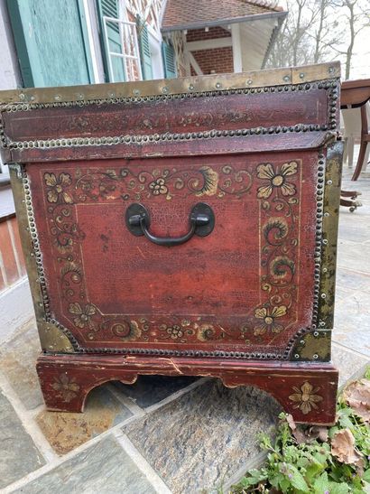 Wooden chest covered with studded burgundy...