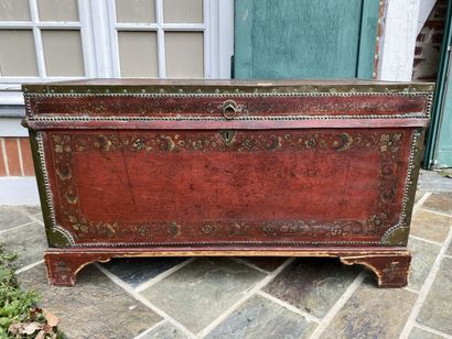 Wooden chest covered with studded burgundy...