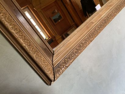 Mirror with natural wood frame, carved with...