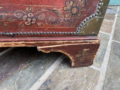 Wooden chest covered with studded burgundy...