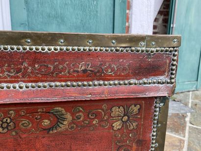 Wooden chest covered with studded burgundy...