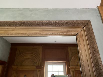 Mirror with natural wood frame, carved with...