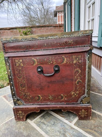 Wooden chest covered with studded burgundy...