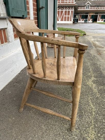 Armchair in natural wood, openwork back decorated...