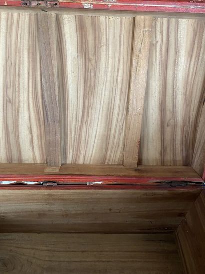 Wooden chest covered with studded burgundy...