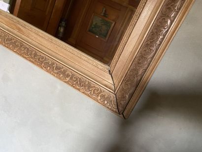 Mirror with natural wood frame, carved with...