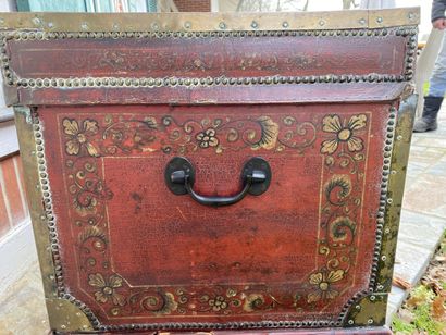 Wooden chest covered with studded burgundy...