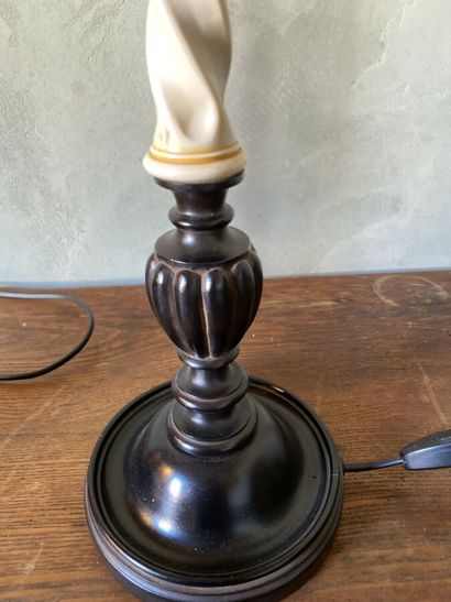Pair of lamp feet in black lacquered composition...
