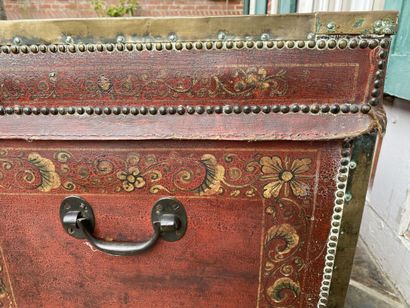 Wooden chest covered with studded burgundy...