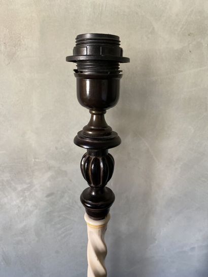 Pair of lamp feet in black lacquered composition...