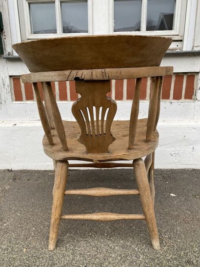 Armchair in natural wood, openwork back decorated...