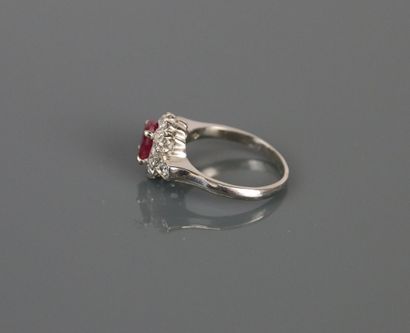 750°/°° white gold ring centered on an oval...