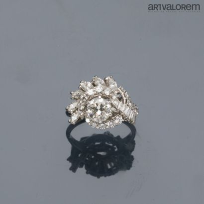 Platinum ring centered on a brilliant-cut...