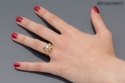 Yellow and white gold 750°/°° ring centered...