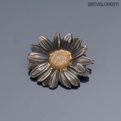MELLERIO
Two-tone metal flower brooch. Marked...