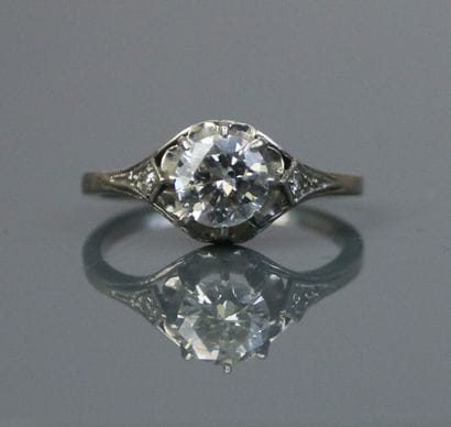 Platinum solitaire set with a claw-set brilliant-cut...