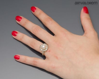 Yellow gold 750°/°° and silver ring centered...