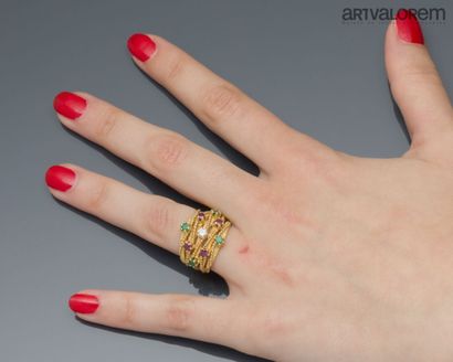 Band ring in yellow gold 750°/°° formed of...