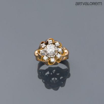 Yellow and white gold 750°/°° ring centered...