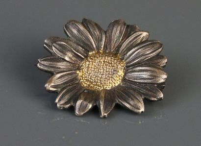 MELLERIO
Two-tone metal flower brooch. Marked...