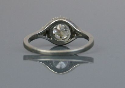Platinum solitaire set with a claw-set brilliant-cut...