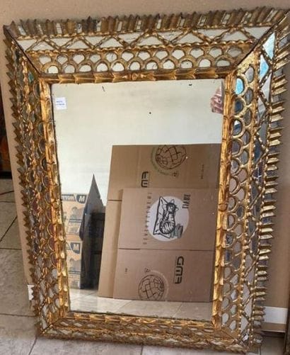 Upside-down mirror in gilded wood, decorated...