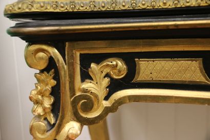 Molded and carved console table in blackened...