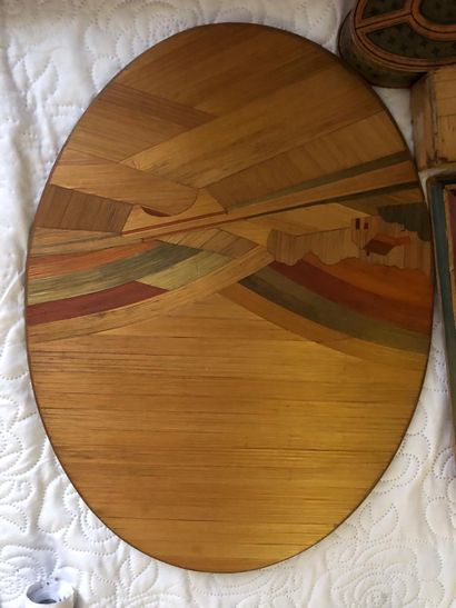 A covered straw marquetry box in the shape...