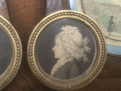 Three profile miniatures of a man and a woman....