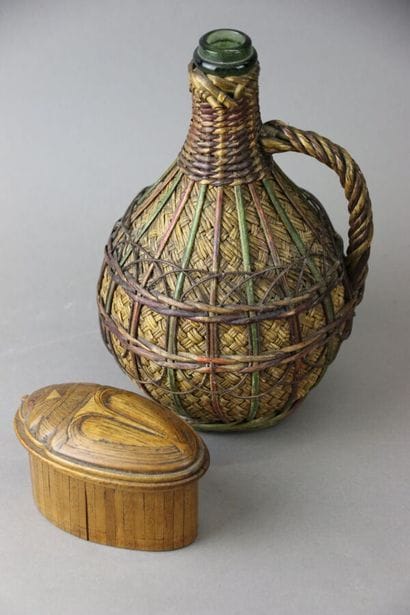 A covered straw marquetry box in the shape...