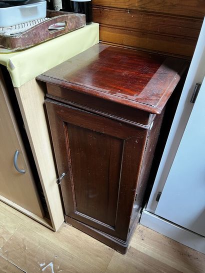 Walnut silverware cabinet opening by a door
H....