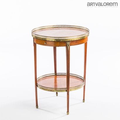 Louis XVI-style pedestal table with two brass-belted...