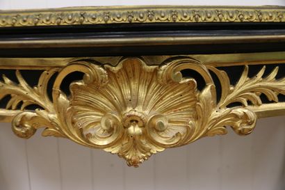 Molded and carved console table in blackened...