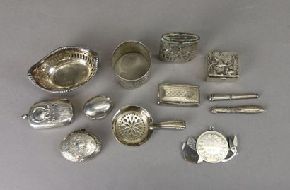 Set of silver display items including: pyrogen...