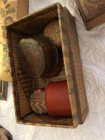 A covered straw marquetry box in the shape...
