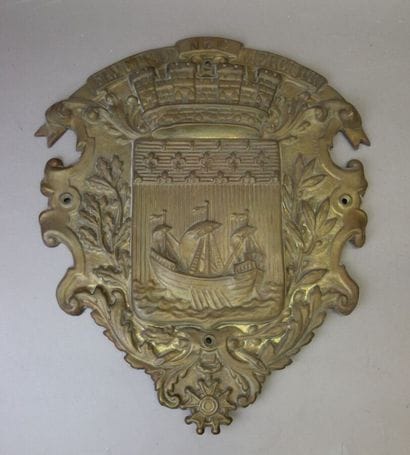 Embossed brass shield with the coat of arms...