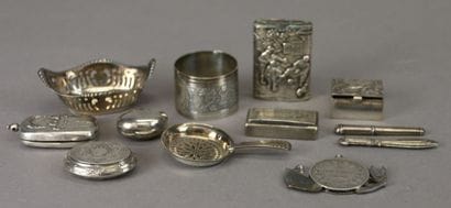 Set of silver display items including: pyrogen...