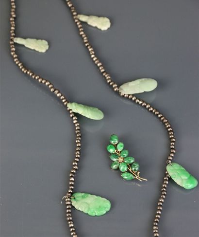 Necklace with silver beads holding engraved...