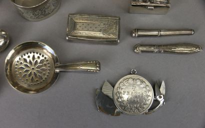 Set of silver display items including: pyrogen...