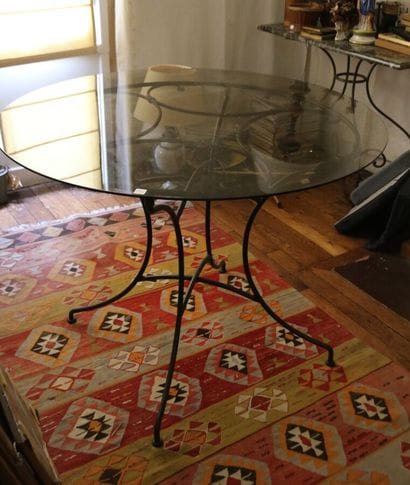 Round table, glass top, wrought-iron scrolled...