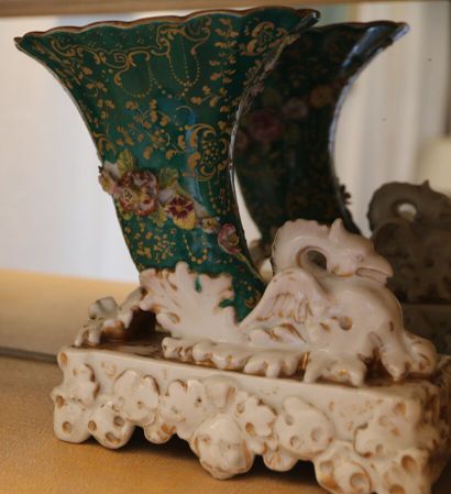 Pair of rhyton vases in porcelain, the bowl...