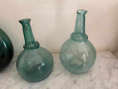 Set of three high-necked globular carafes...