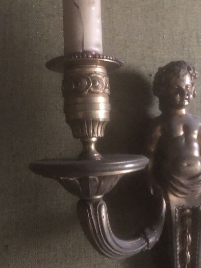 Pair of ormolu sconces decorated with putti...