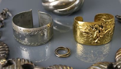 Lot of costume jewelry including metal bangle...