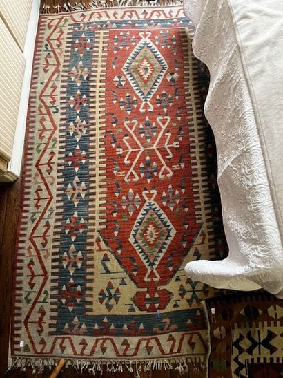 Three Kilim rugs in wool with geometric motifs.
115...