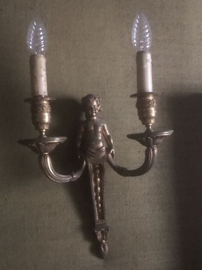 Pair of ormolu sconces decorated with putti...