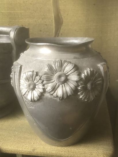Set comprising: a pewter vase decorated with...