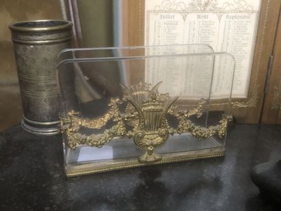 Scales, a brass socket, a glass and brass...
