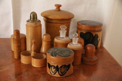Nine boxwood boxes, two of which are painted...